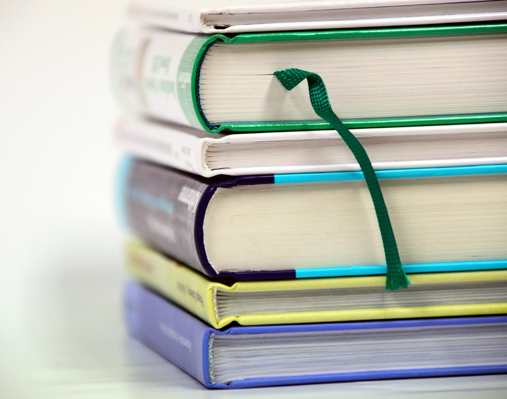 Stacked Books On White Background